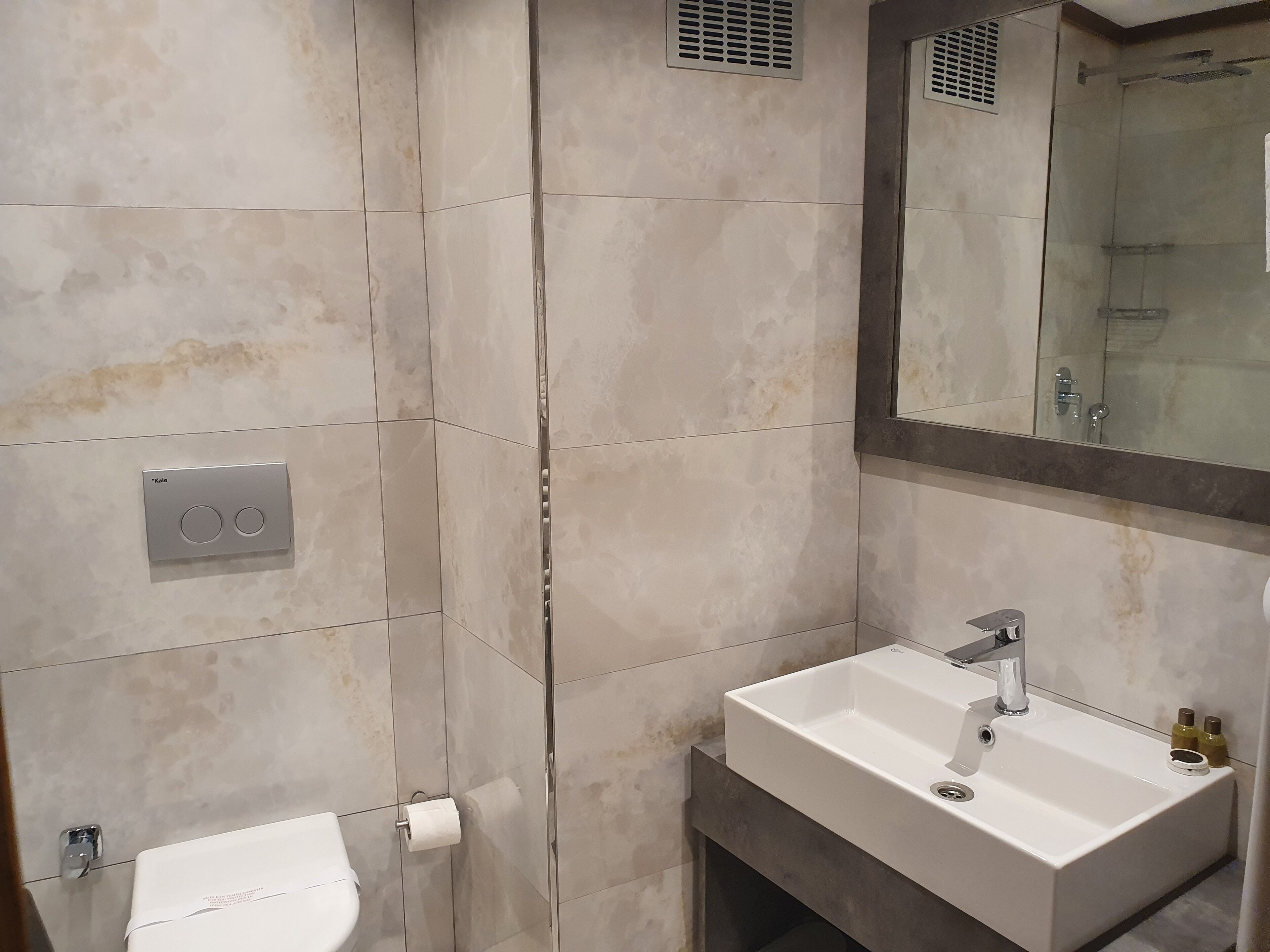 shower, hair dryer, slippers, towels