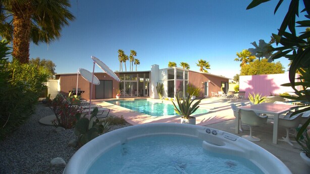 A backyard with a swimming pool, a hot tub, and outdoor furniture. - Mr. Pink's MCM Alexander with Pool, Hot Tub, Fire Pit (Palm Springs)