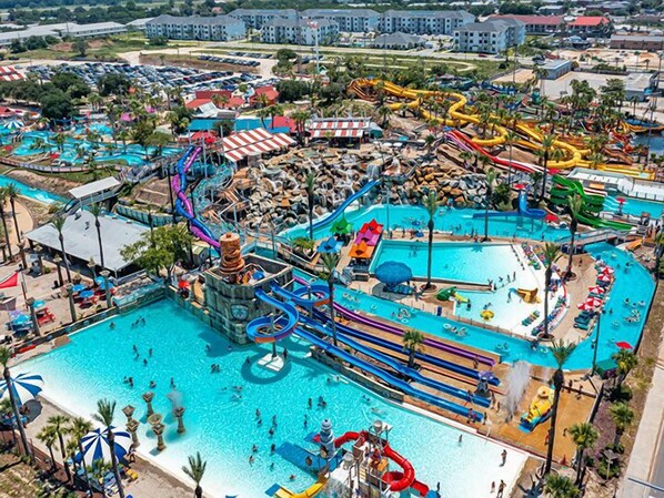 Enjoy swimming and sliding at this vibrant water park with multiple pools and slides.