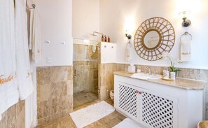 Shower, hair dryer, towels, shampoo