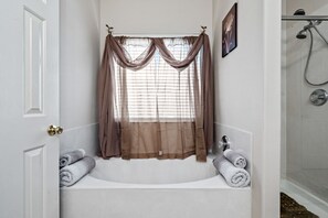 Combined shower/tub, towels, soap, shampoo