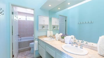 Combined shower/bathtub, hair dryer, towels, soap