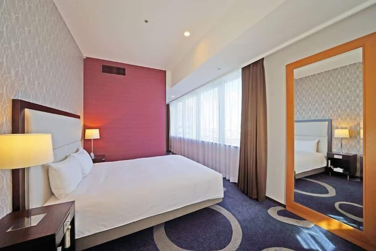 Premium bedding, down duvets, blackout curtains, free WiFi
