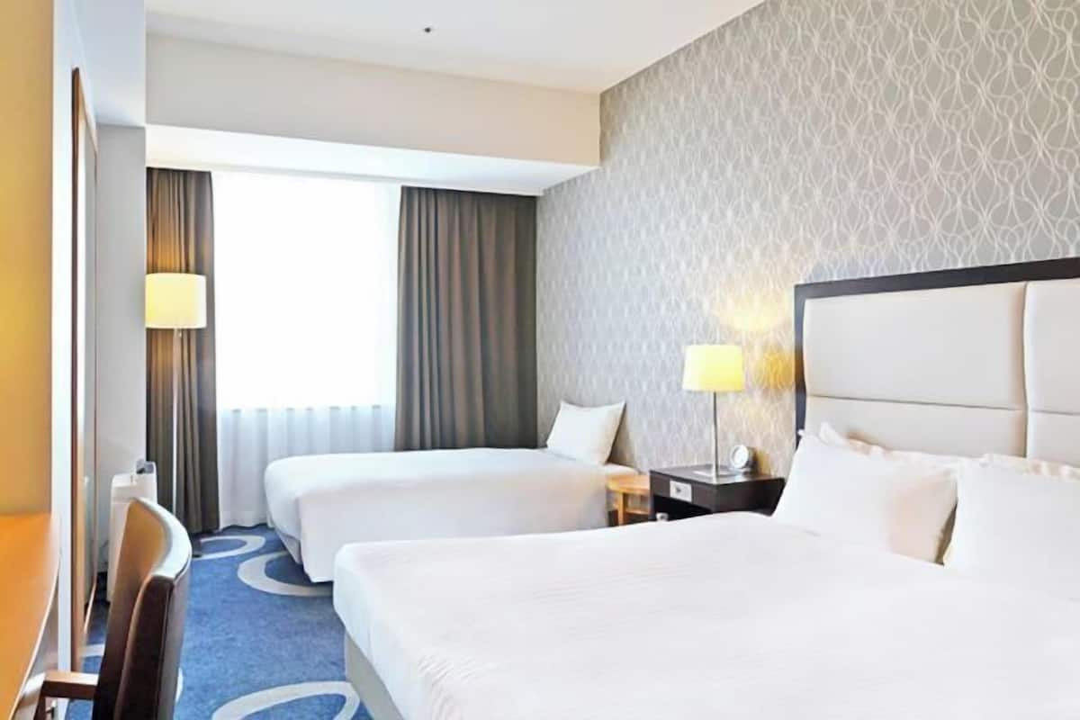 Premium bedding, down duvets, blackout curtains, free WiFi