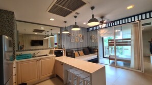 Condo família, 1 quarto, vista para o jardim | Área de estar