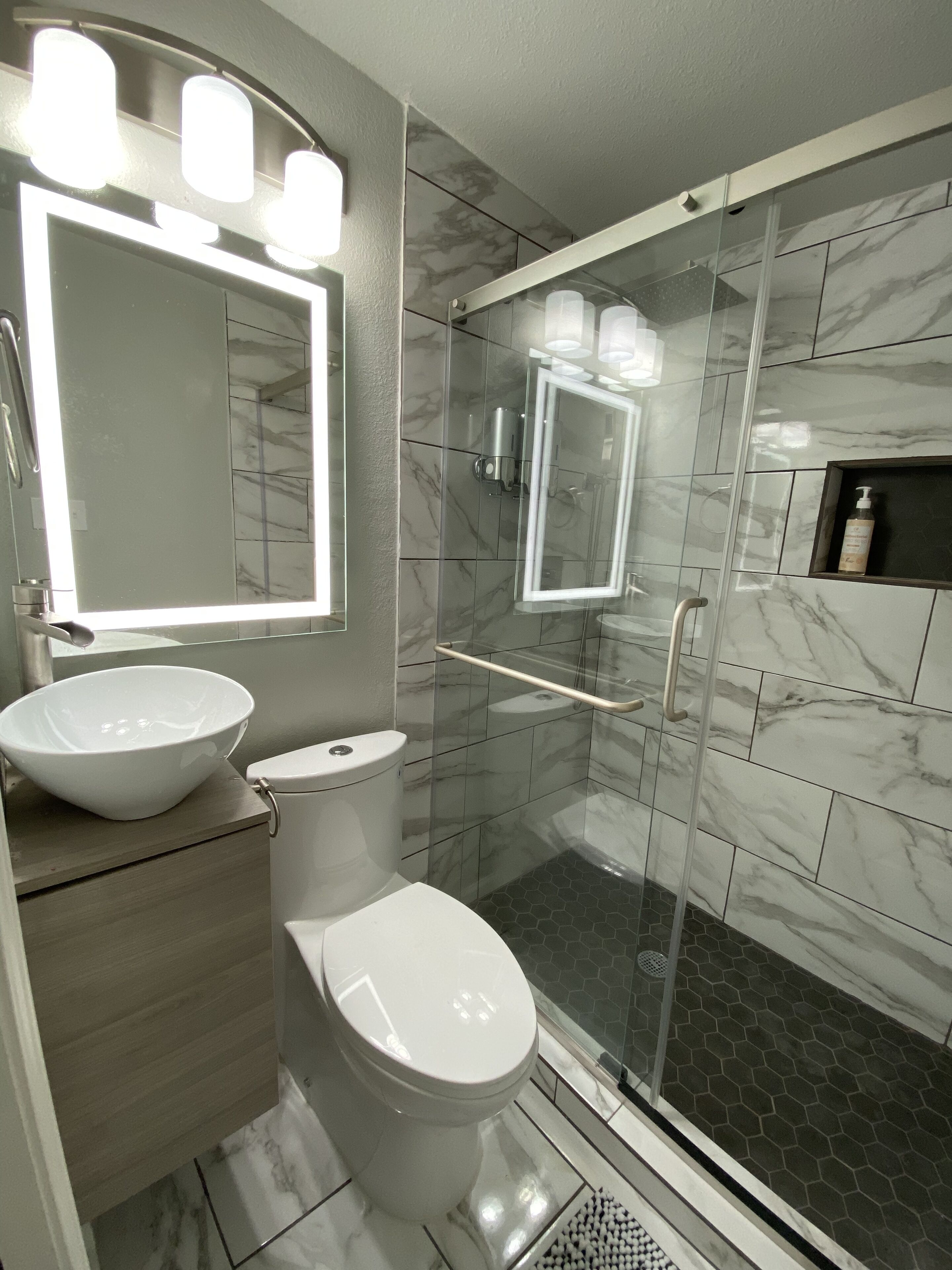 Bathtub, hair dryer, towels, soap