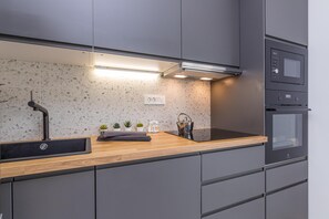 Standard Apartment, Multiple Bedrooms, 2 Bathrooms (Pool Apartment Sapore Di Mare 2) | Private kitchen | Fridge, oven, stovetop, dishwasher - Pool Sapore Di Mare Apartments (Baska)