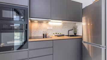 Standard Apartment, 2 Bedrooms, 2 Bathrooms (Pool Apartment Sapore Di Mare 1) | Private kitchen | Fridge, oven, stovetop, dishwasher