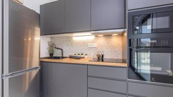 Standard Apartment, 2 Bedrooms, 2 Bathrooms (Pool Apartment Sapore Di Mare 2) | Private kitchen | Fridge, oven, stovetop, dishwasher