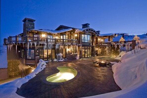 Experience the perfect blend of modern and traditional architecture at this luxurious lodge, featuring a heated outdoor pool and serene surroundings.