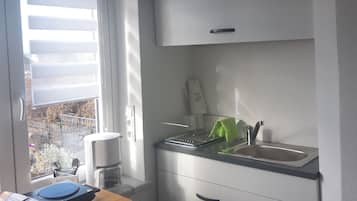 Fridge, coffee/tea maker, electric kettle, toaster