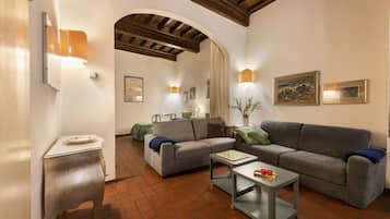 Comfort Studio | Living area | Flat-screen TV