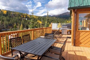Enjoy al fresco dining with a scenic view of the surrounding forest and mountain.