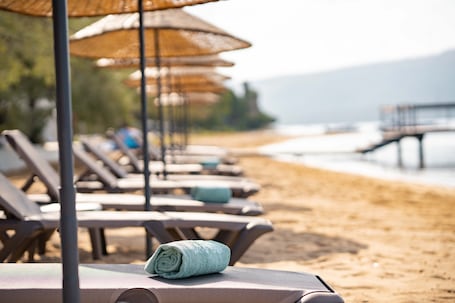 Private beach, sun loungers, beach umbrellas, beach towels