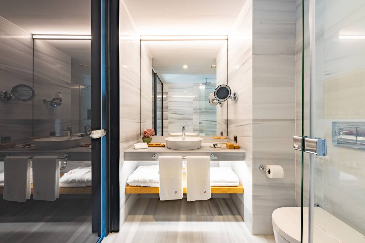 comfort villa | bathroom | shower, rainfall showerhead, hair dryer, bathrobes