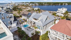 A coastal residential area with houses, a swimming pool, and a view of the sea. - Seagrove Sparrow|Easy Beach Access|Private Pool|Outdoor Oasis (Santa Rosa Beach)