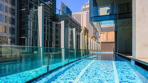 Experience the urban oasis with a stunning pool view, surrounded by sleek contemporary architecture.