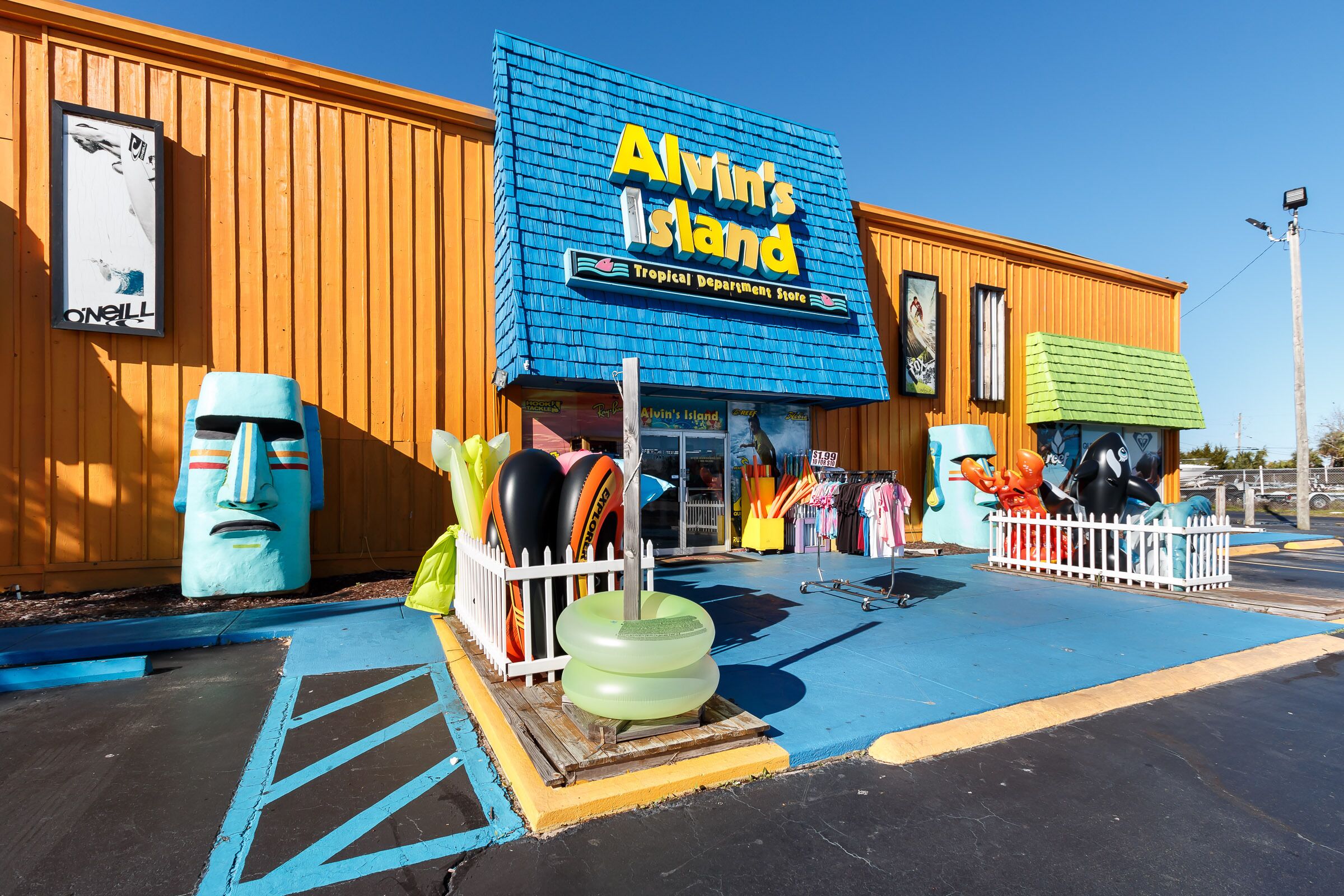 A storefront with a sign reading "Alvin's Island Tropical Department Store."