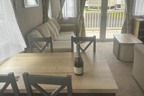 Cabin | Living area | 30-inch TV with cable channels, fireplace - Charming 5-beds Caravan in Beautiful Seton Sands (Prestonpans)