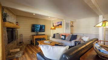 Smart TV, fireplace, books, printers