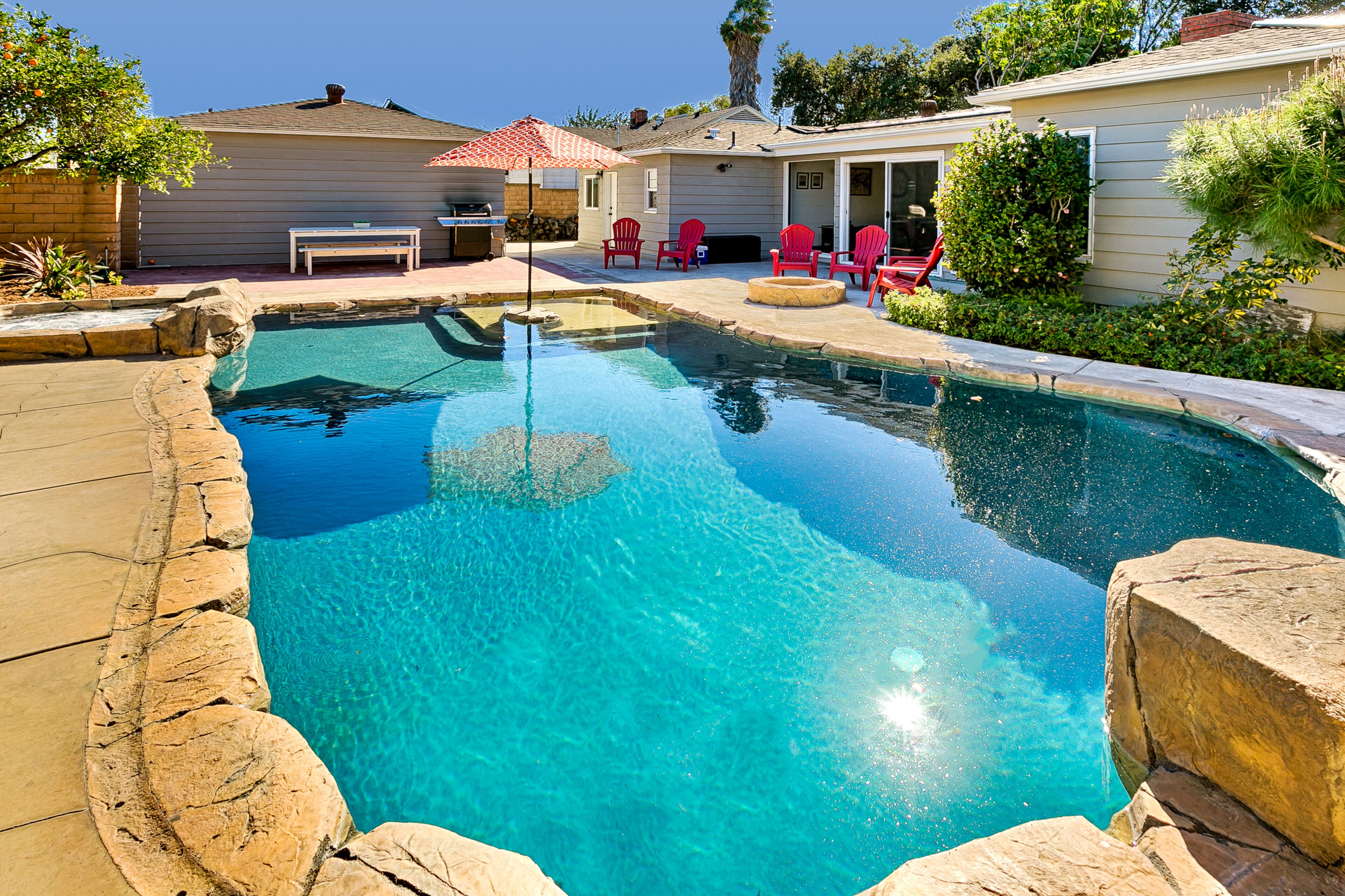 Dog-friendly home close to Disneyland with a saltwater pool, hot tub, & firepit