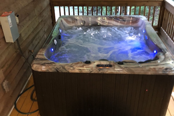 Super-nice hot tub with lighting and Bluetooth speakers.