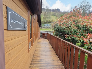 A wooden building with a sign reading 'elder lodges The Lakes.'