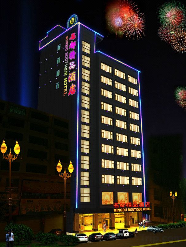 A multi-story hotel with illuminated signage and a prominent entrance.