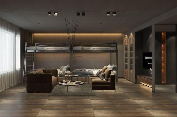 A modern living room with a sofa, armchair, and coffee table. There is a bunk bed in the background and a TV on the right wall. - Yunyi Art Hotel (Rizhao)