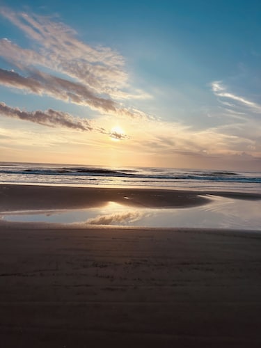 Steps from the beach. This Beach House is a comfy user friendly home. 