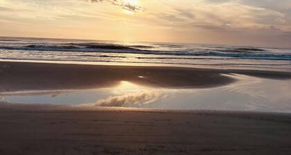 Steps from the beach. This Beach House is a comfy user friendly home.