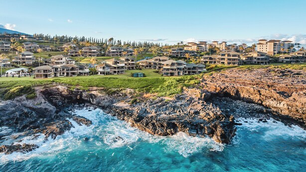 A coastal resort with multiple beachfront villas, rocky shoreline, and clear blue waters. - Steps from Merriman's, Your Kapalua Villa stay (Lahaina)