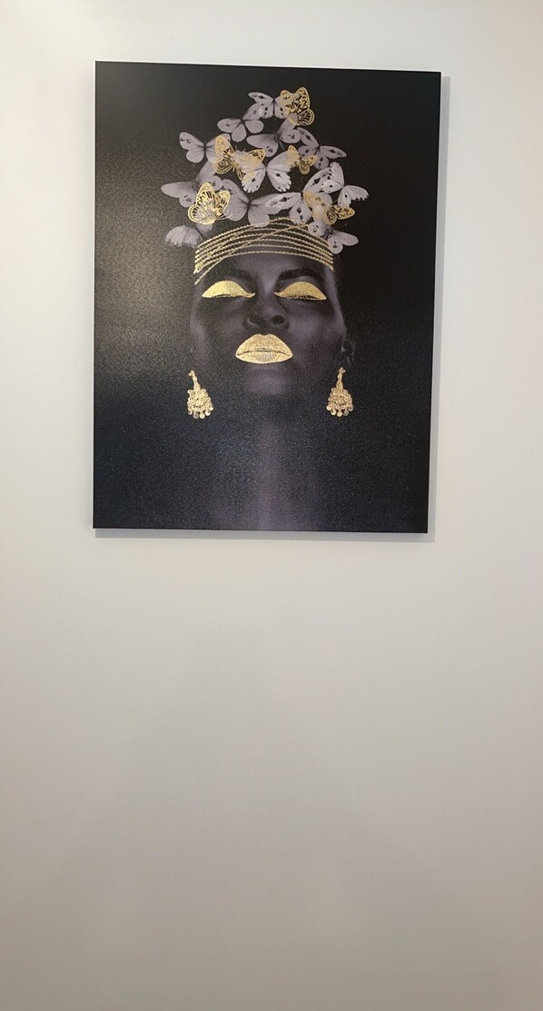 A framed artwork on a wall.