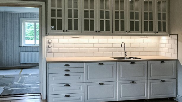 A kitchen with white cabinets, a sink, and a window. - Gorgeous home in Bodafors with kitchen (Bodafors)