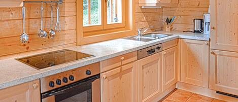 Fridge, stovetop, dishwasher, coffee/tea maker