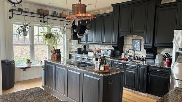 A modern kitchen with dark cabinetry, granite countertops, and a central island. - Spectacular long range views! 5 minutes from Franklin. Private w/paved driveway. (Franklin)