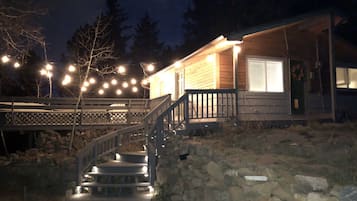 Step up to the porch and enjoy the warm ambiance of this cozy cabin.