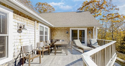 Woodland hideaway with lake access, private game room, fireplace, & luxe kitchen