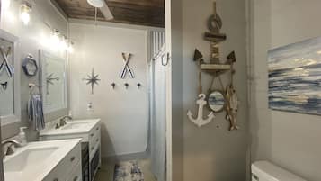 Combined shower/tub, hair dryer, towels, toilet paper