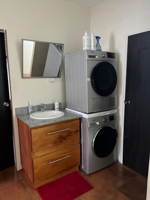 Shower, hair dryer, towels, soap