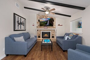Smart TV, fireplace, foosball, books