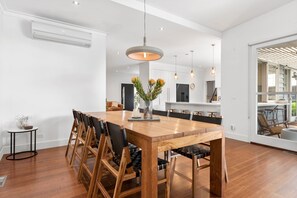 Enjoy dining in this spacious room with a large table and comfortable chairs.