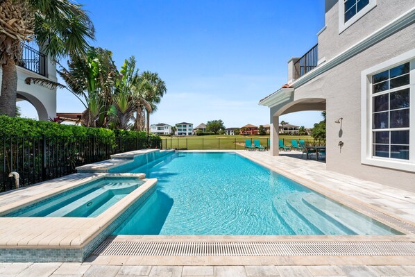 A heated pool, pool loungers