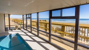 A balcony with a view of the beach, a pool, and a wooden deck. - *Fall into Savings-20% Off New Bookings thru 2026* (Murrells Inlet)