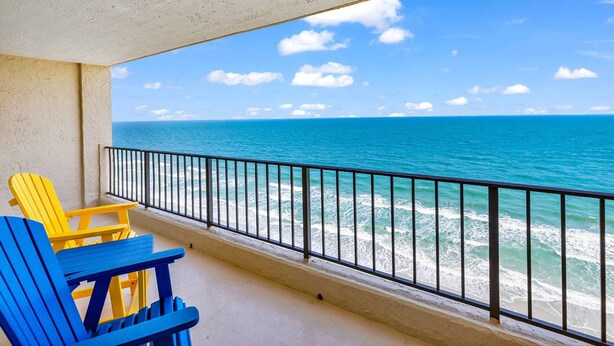 A balcony with a view of the ocean, featuring two chairs and a railing. - *Fall into Savings-20% Off New Bookings thru 2026* (Murrells Inlet)