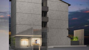 A modern building with a symmetrical facade, large windows, and a flat roof. - KYOTO GRANBELL HOTEL hanareya (Kyoto)