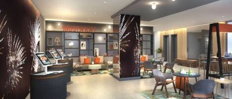 A modern hotel lobby with seating areas, a reception desk, and a large wall with a 'MUSTA' sign.