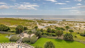 A coastal resort with a beach view, a pool area, and a boardwalk. - Vacation on St Simons Island! Pool, Beach Access, Fitness Center, Tennis! (Saint Simons Island)