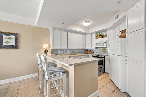 Coffee/tea maker, fridge, microwave, oven
