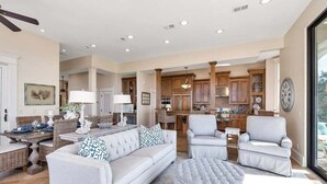 A spacious living area with a sofa, armchairs, and a dining table. - Luxurious Complex, Ocean Views. Steps from Beach. (Saint Simons Island)